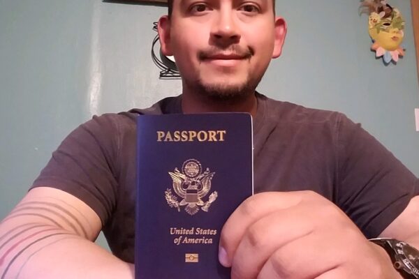 Mark Esqueda with his new passport