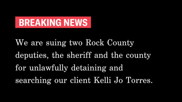 Black background, white text reads: "Breaking News. We are suing two Rock County deputies, the sheriff and the county for unlawfully detaining and searching our client Kelli Jo Torres.