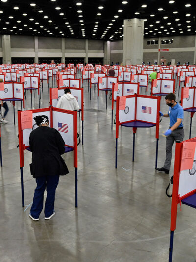 Photo of multiple voting stations set up in the Kentucky Exposition Center for voters to cast their ballot.