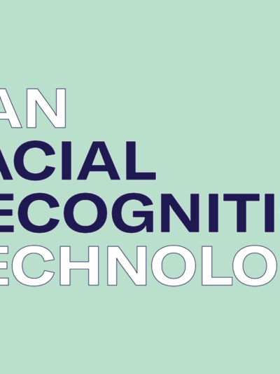 An image of a surveillance camera looms in the background.