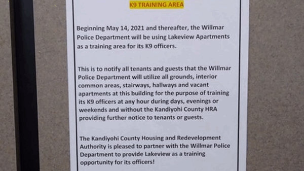 A sign posted informs residents about the K-9 training partnership.