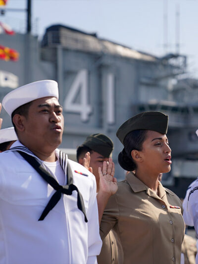 United States Navy sailors and Marines from ten different countries take an oath of citizenship during a ceremony for members of the military aboard the USS Midway Museum Friday, July 2, 2021, in San Diego.