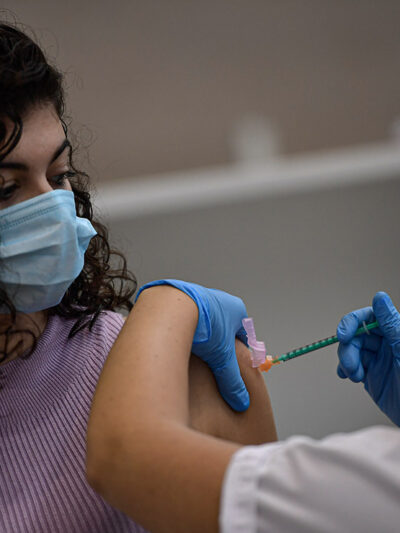 A woman receives the Pfizer COVID-19 vaccine, Thursday, Sept. 2, 2021.