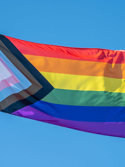 Image of inclusive Pride flag flowing in the wind