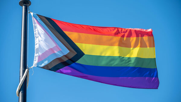 Image of inclusive Pride flag flowing in the wind