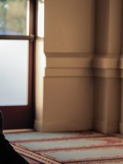 Ali Malik praying in a mosque