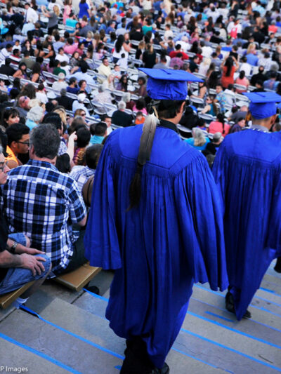 A Native American student is wearing an eagle feather to his high school graduation.