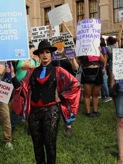 Demonstrators with pro-abortion-and-LGBTQ signage.