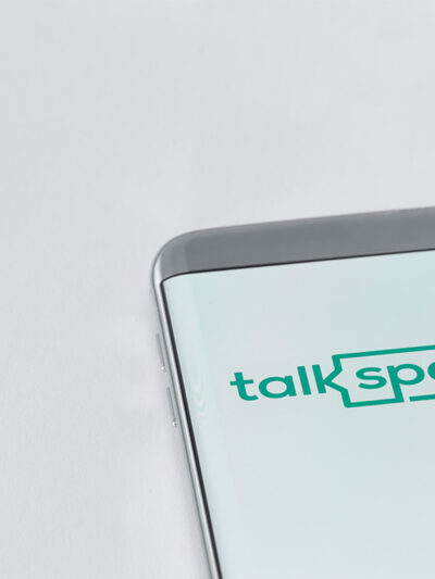 Image of Talkspace app on a smartphone on a white background.