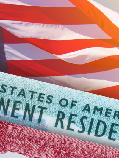 Visa and permanent resident card on top of an american flag