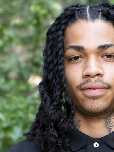 Kylese Perryman headshot in front of trees