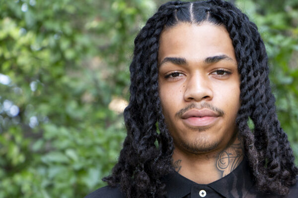 Kylese Perryman headshot in front of trees