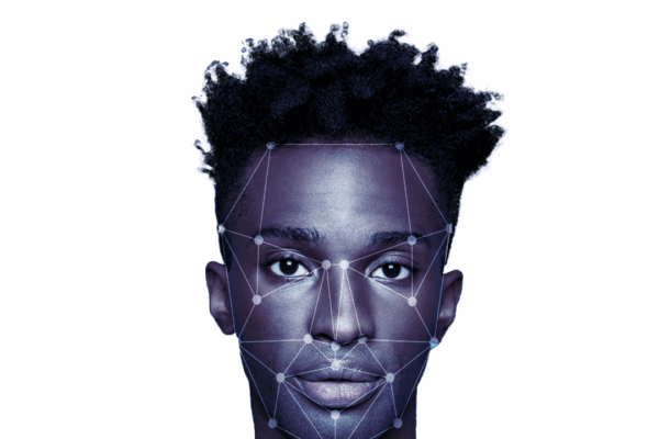 Headshot of man with dots and lines on his face suggesting it is being scanned.