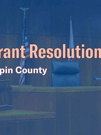 Photo of a courtroom with text that says "Warrant resolution day, Hennepin County."