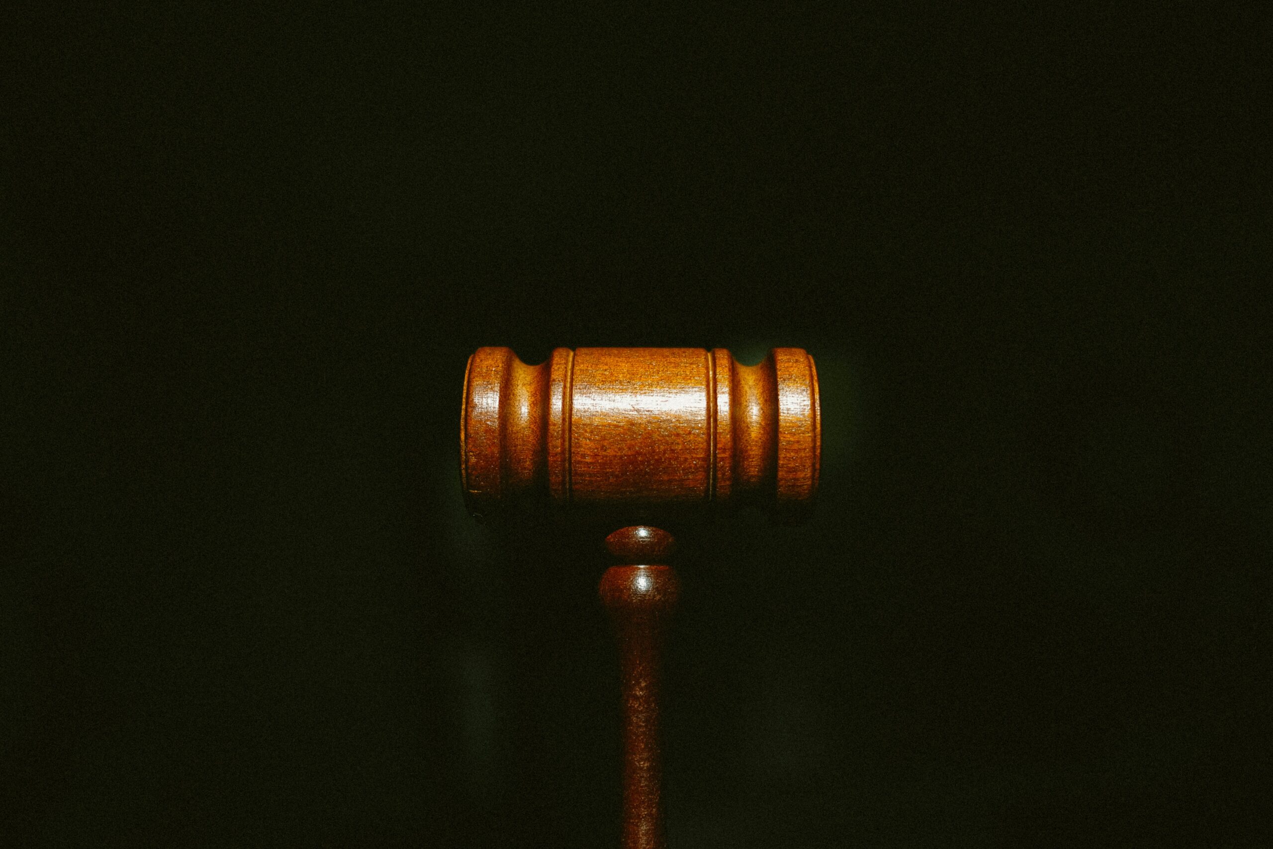 Photo of a gavel in front of a black background
