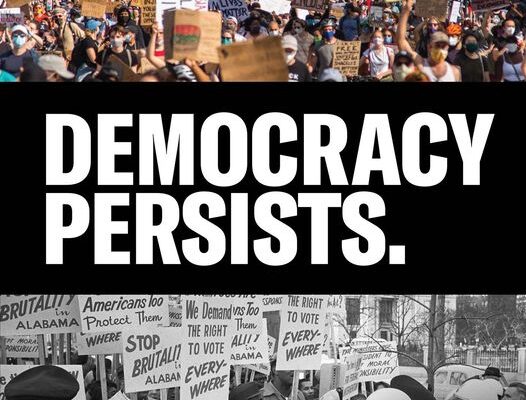 The bottom of image is a black and white photo of people protesting. The top of the image is a color photo of people protesting. The middle of the image says, "democracy persists."
