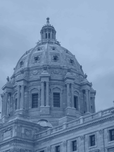 A black, blue and white photo of the exterior of the Minnesota Capitol's dome