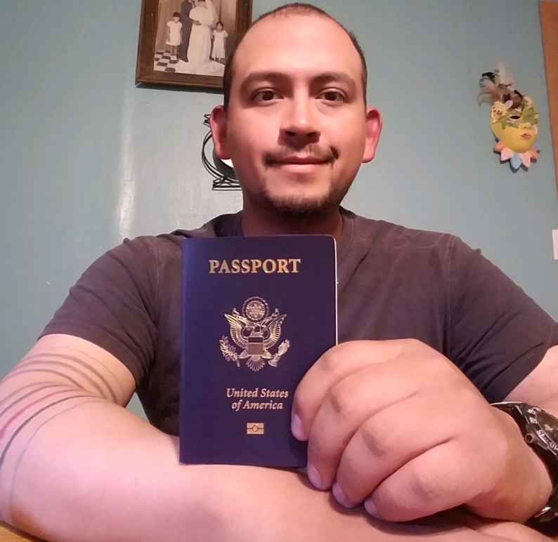 Mark Esqueda with his new passport