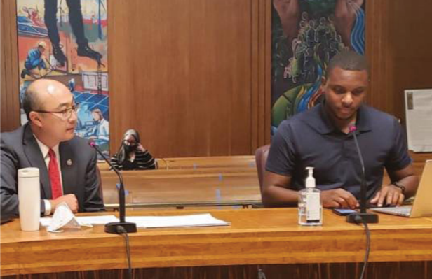 Elizer Darris testifies at a hearing while Ramsey County Attorney John Choi observes.