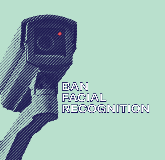 Navy blue surveillance camera on a light green background. Ban Facial Recognition.
