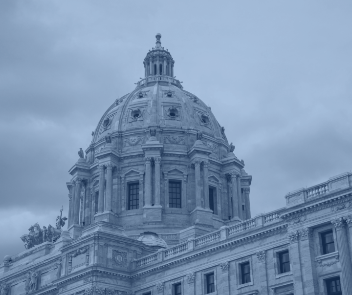 A black, blue and white photo of the exterior of the Minnesota Capitol's dome