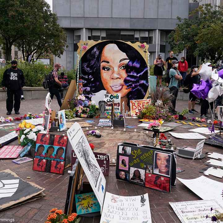 People gather in Jefferson Square in Louisville, awaiting word on charges against police officers in the death of Breonna Taylor.