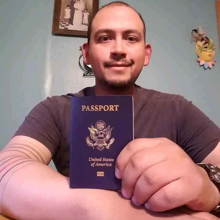 Mark Esqueda with his new passport