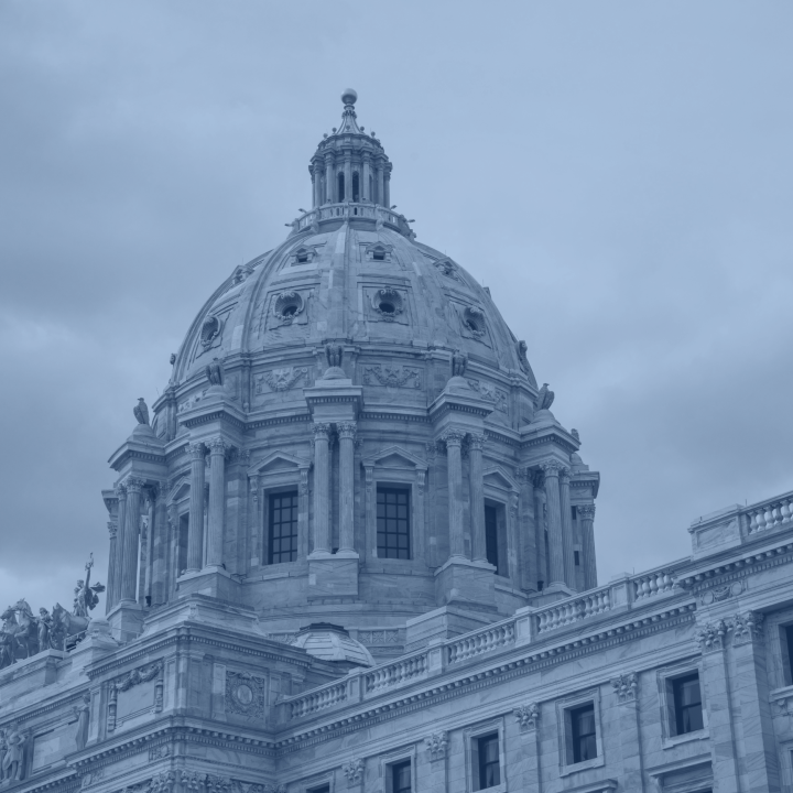 A black, blue and white photo of the exterior of the Minnesota Capitol's dome