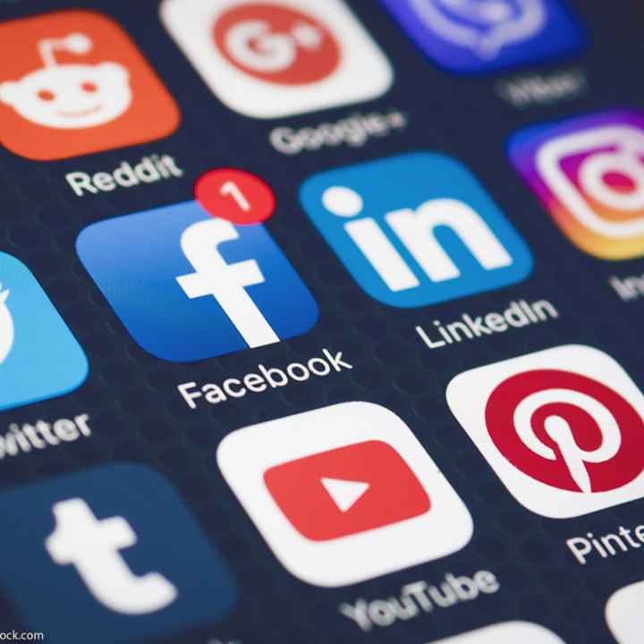 Social media icons on a smartphone screen.