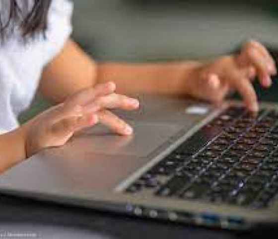 image of child at laptop computer